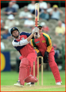 Paul Nixon watches as Michael Atherton is caught