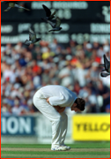 Chris Cairns avoids pigeons during Oval Test Match.