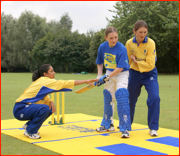 England's Isa Guha & Charlotte Edwards coaching youngsters.