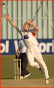 Andrew Flintoff fields off his own bowling