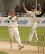 Graeme Swann celebrates the wicket of Mark Hardinges