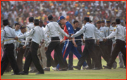 Security surround England captain Andrew Flintoff after the 2nd ODI, Faridabad, India.