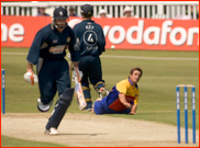 Bowler Ryan Ten Doeschate tries to run out Justin Kemp 