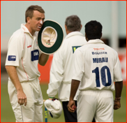 Dominic Cork whispers to Muttiah Muralitharan