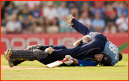 Bowler Chris Taylor ends up on top of James Adams