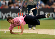 Bowler Steven Finn fails to stop a Justin Kemp drive