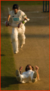 Liam Dawson runs past bowler Charlie Shreck