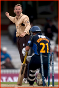 Chris Schofield celebrates bowling Carl Hopkinson