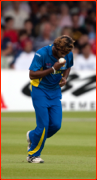 Lasith Malinga kisses the ball as he runs in to bowl.