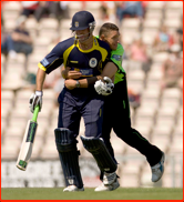 Bowler Andre Nel playfully tackles batsman Sean Ervine