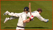 Geraint Jones stops a wayward ball off Simon Cook