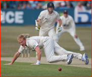 Bowler Steve Kirby fails to stop an Ed Joyce drive