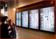 The new high-tech score screens in the pavilion get a last minute tweak