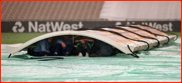 A wet OT. Groundstaff shelter under the covers, 1998