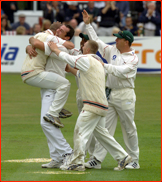 Scott Boswell hugs Darren Stevens for catching Atherton