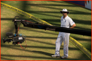 Jonathan Trott watches a TV camera swing over the pitch