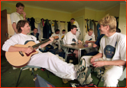 Captain Dermot Reeve playing his guitar, Canterbury