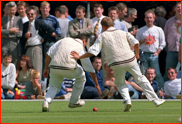 Alec Stewart (playfully) jostles captain Adam Hollioake