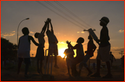 Township children playing cricket.