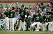 Surrey ball boys watch from the boundary