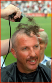 Ian Botham has his head shaved for charity, New Zealand.